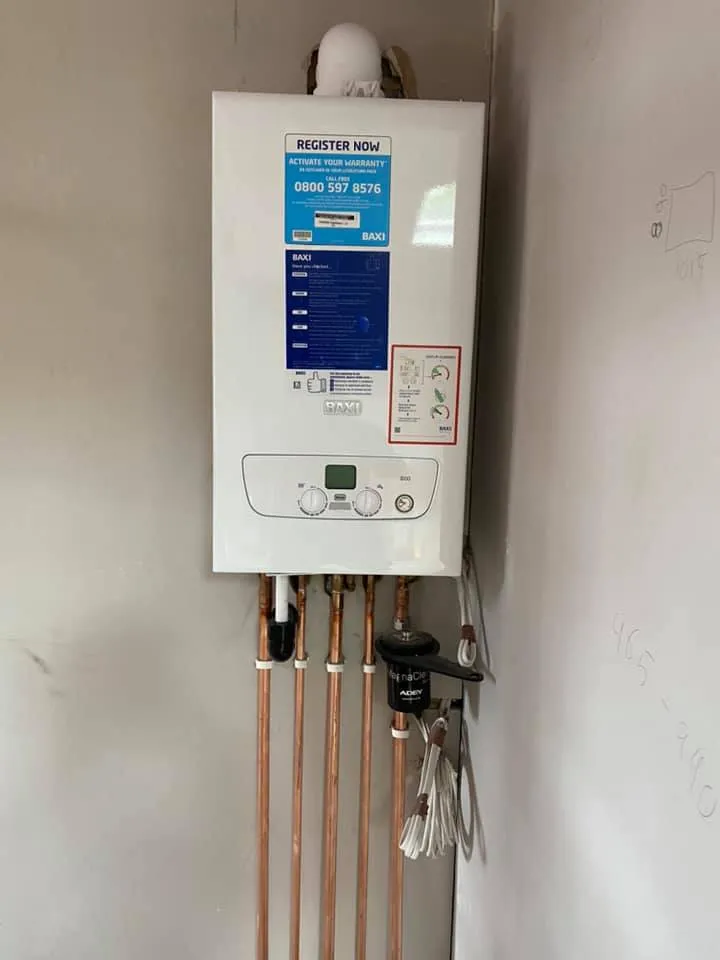 A tank mounted to the side of a wall.